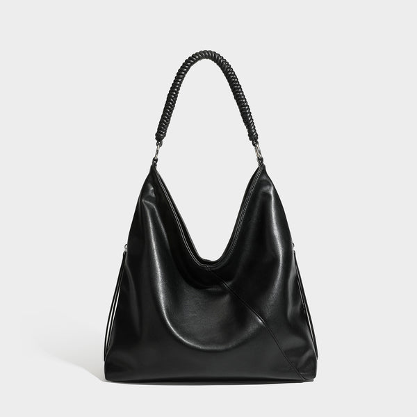Large slouchy hobo shoulder bag with braided top handle, smooth glossy leather-look finish, and silver-tone ring hardware