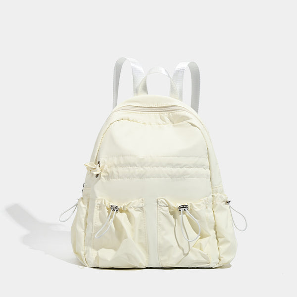 Puffy matte nylon mini backpack with drawcord gathered front pockets and silver-tone hardware, detail view 6