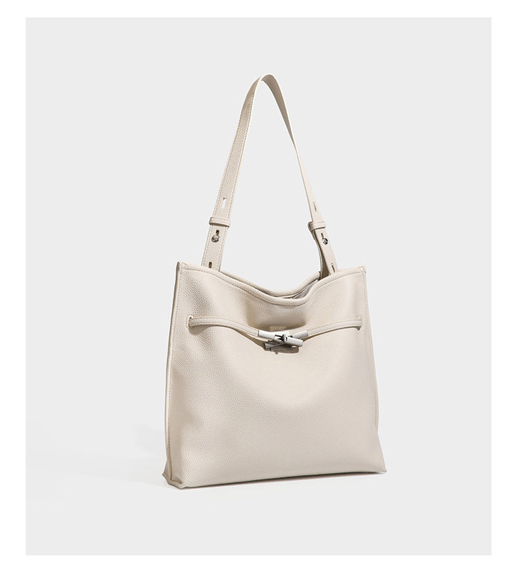 Pebbled leather-look tote bag with front toggle hardware and long shoulder strap, detail view 15