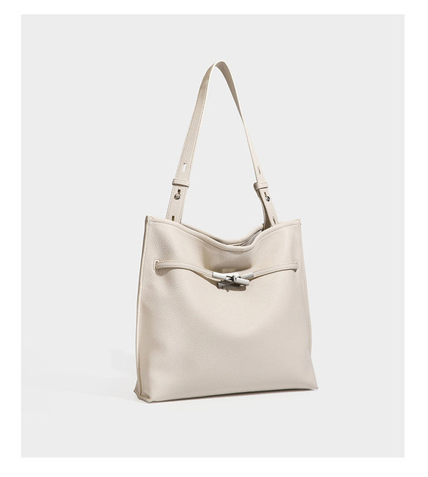 Pebbled leather-look tote bag with front toggle hardware and long shoulder strap, detail view 15