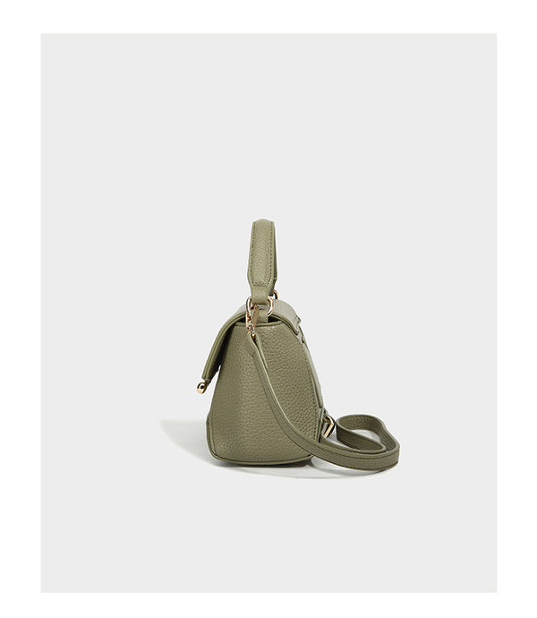 Small structured pebbled flap mini satchel with gold-tone bar hardware, short top handle, and detachable crossbody strap