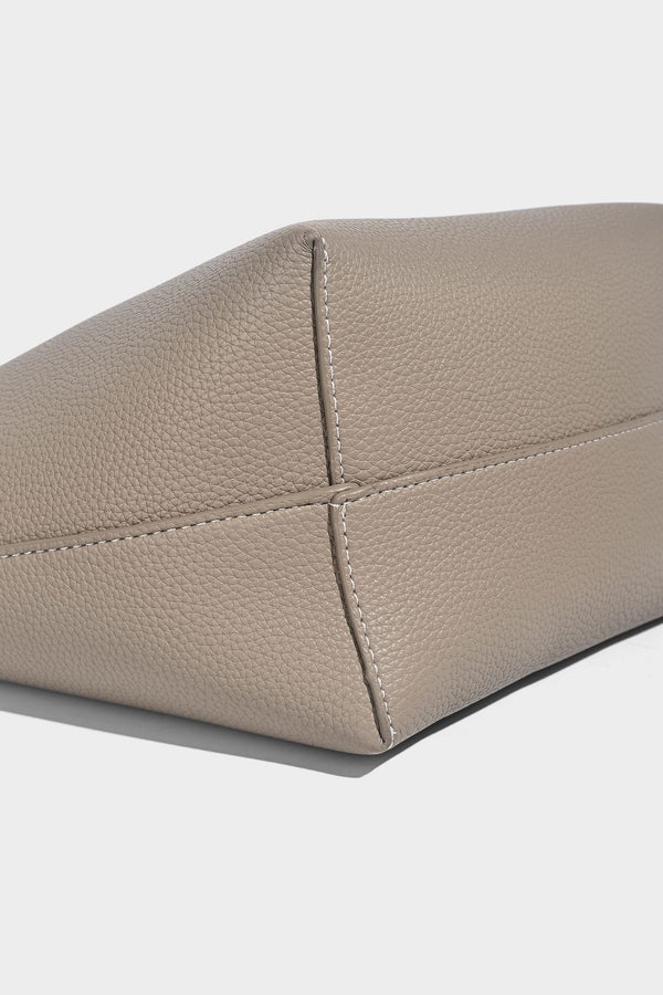 Structured pebbled leather-look tote bag in taupe with long shoulder strap, detachable zip pouch, and pink tulip flower