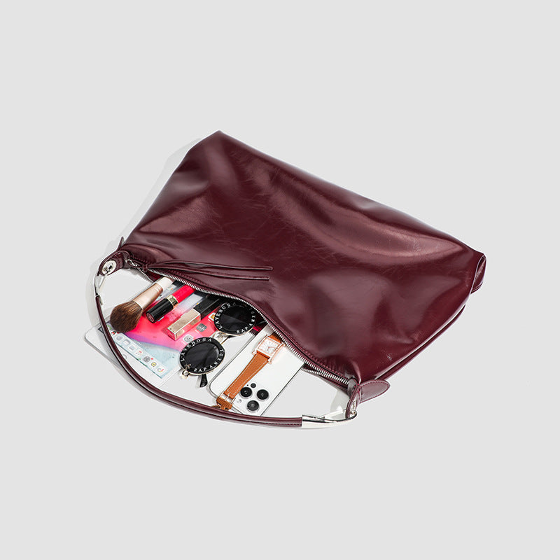 Glossy structured shoulder tote bag with silver-tone hardware and top zip closure, detail view 4