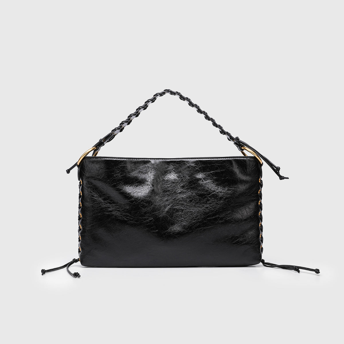 Large slouchy hobo shoulder bag with braided top handle, gold-tone O-ring hardware, and lace-up side cord detailing in