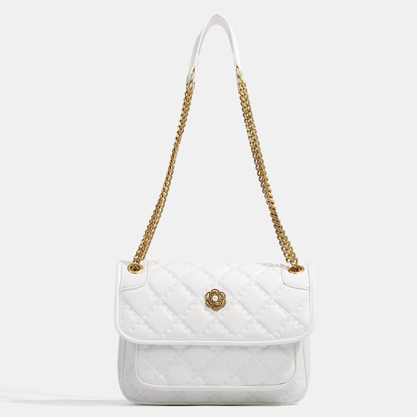 Compact diamond-quilted flap shoulder bag with gold-tone chain strap and floral turn-lock clasp, detail view 7