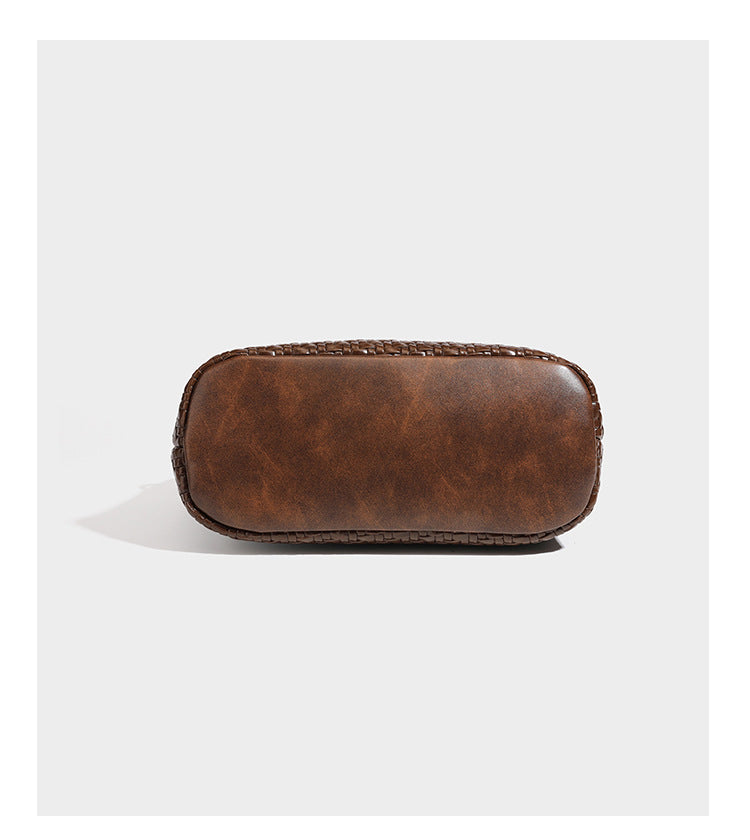 Woven leather-look tote bag in mocha brown with knotted top handle, front flap pocket, and detachable crossbody strap with