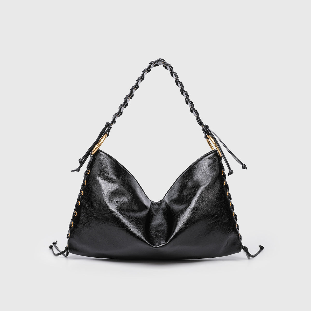 Large slouchy hobo shoulder bag with braided top handle, gold-tone O-ring hardware, and lace-up side cord detailing in