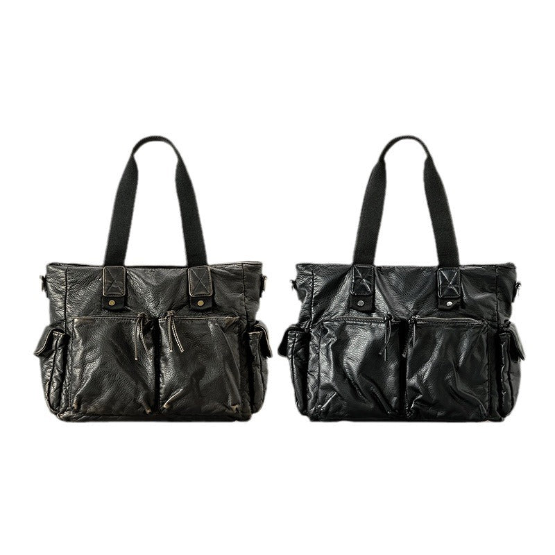 Slouchy crinkled pebbled leather-look convertible tote bag in gunmetal black with woven top handles, adjustable shoulder