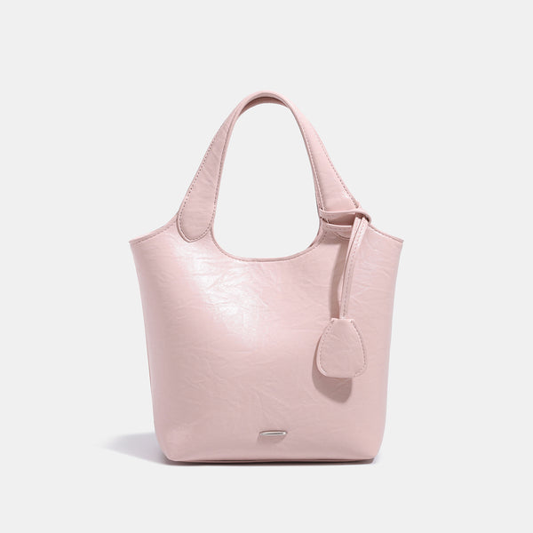 Soft glossy leather-look bucket tote bag with twin handles and detachable crossbody strap, front view