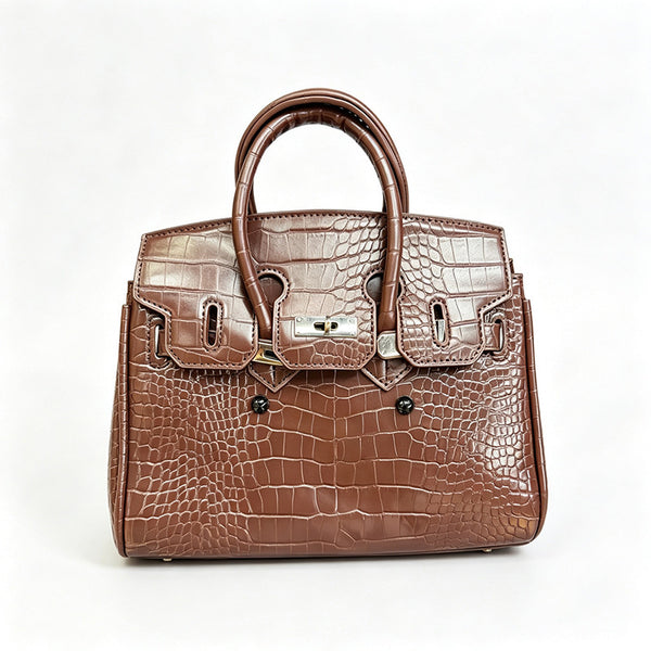 Croc-embossed structured trapezoid satchel with silver turn-lock hardware, rounded top handles, and detachable shoulder