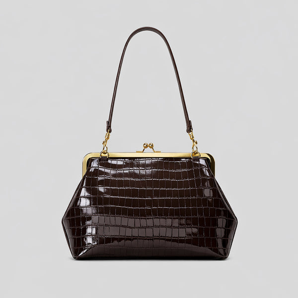 Trapezoid kiss-lock frame shoulder bag with gold-tone hardware and slim adjustable strap, detail view 7