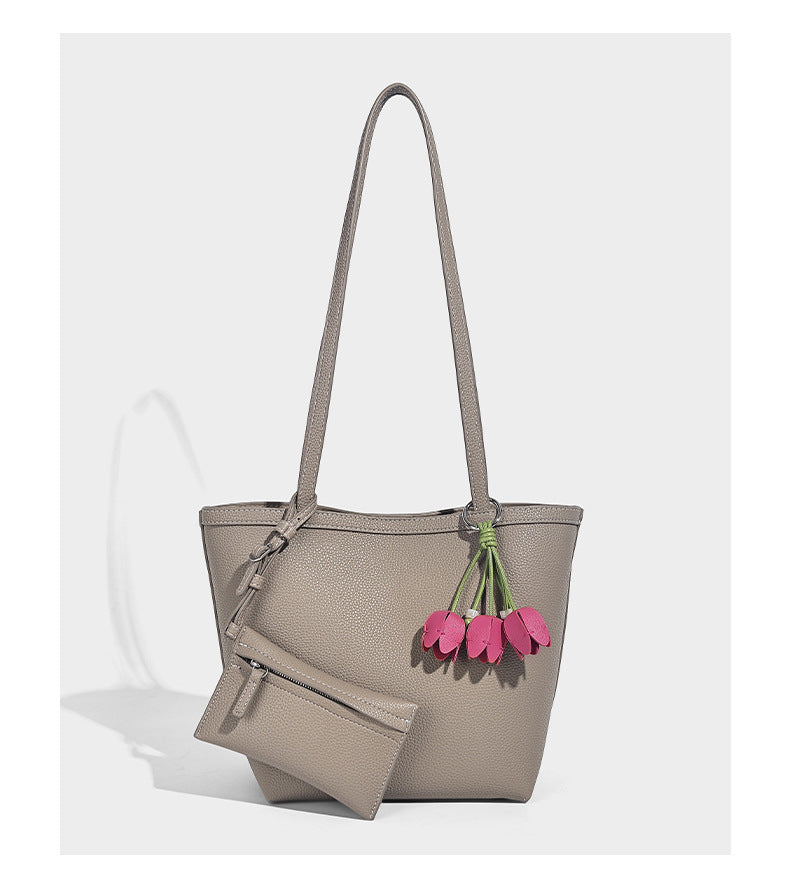 Structured pebbled leather-look tote bag in taupe with long shoulder strap, detachable zip pouch, and pink tulip flower