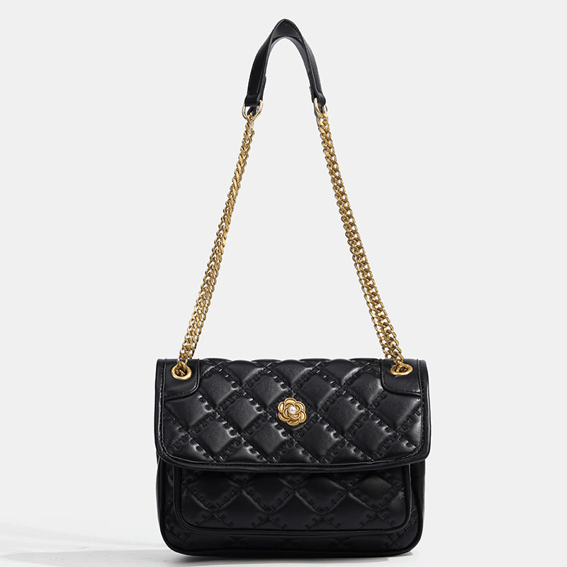 Compact diamond-quilted flap shoulder bag with gold-tone chain strap and floral turn-lock clasp, detail view 6