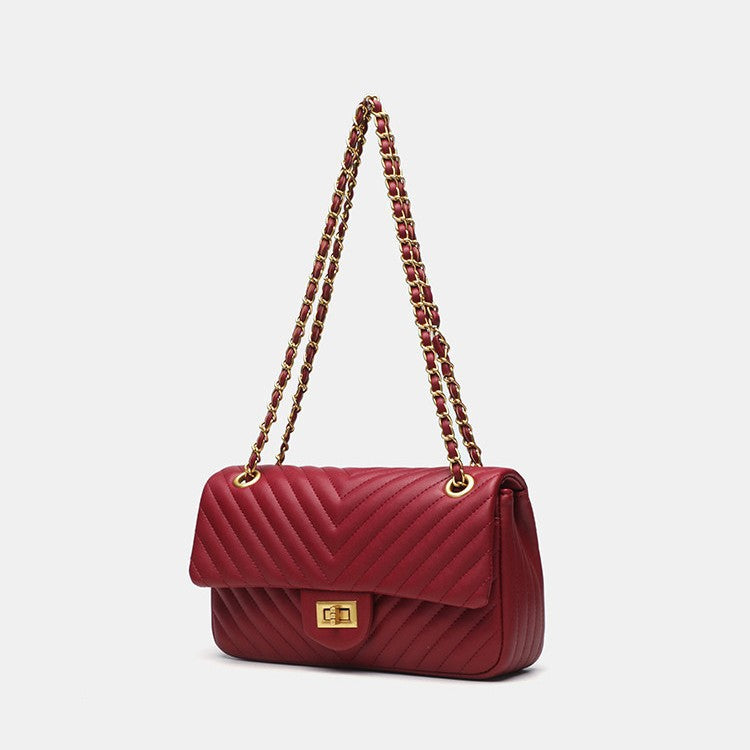 Structured quilted flap bag with gold-tone chain strap and turn-lock closure, detail view 4