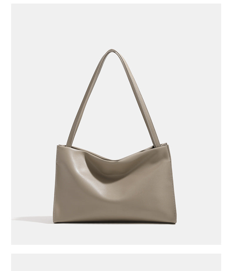Smooth leather-look slouchy trapezoid shoulder tote with gold-tone gourd clasp hardware and long slim straps, detail view 8