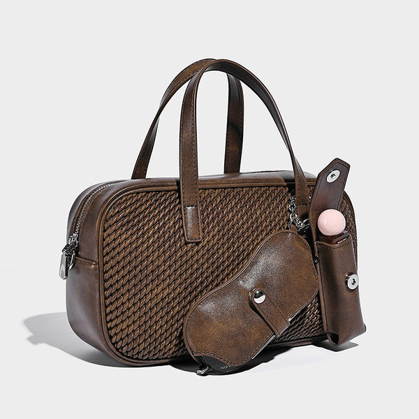 Structured woven-texture front top-handle handbag with zip closure, dual handles, detachable shoulder strap, and matching