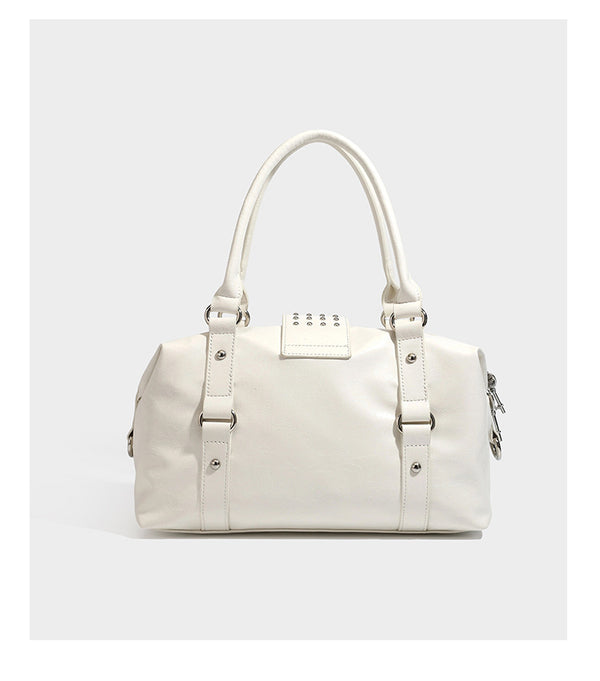 Glossy crinkled barrel handbag with silver stud buckle strap and detachable shoulder strap, detail view 16