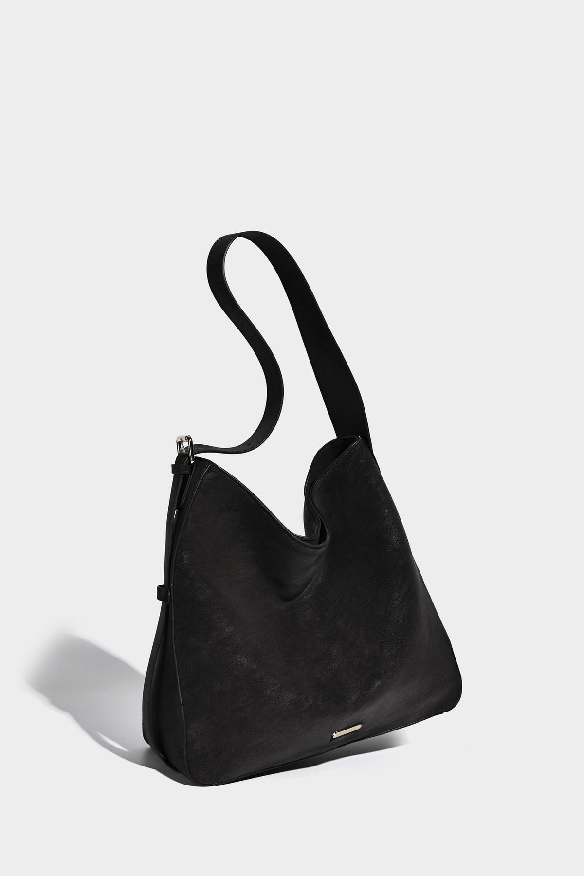 Large slouchy hobo shoulder bag in matte leather-look finish with adjustable strap and gold-tone bar hardware, detail view 20