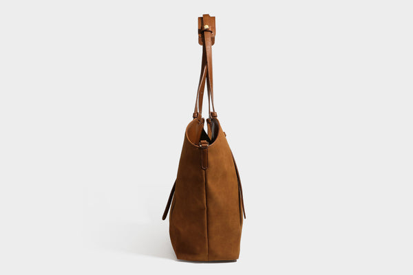 Oversized suede-finish tote shoulder bag in caramel brown with slim leather-look straps and gold-tone logo hardware, detail