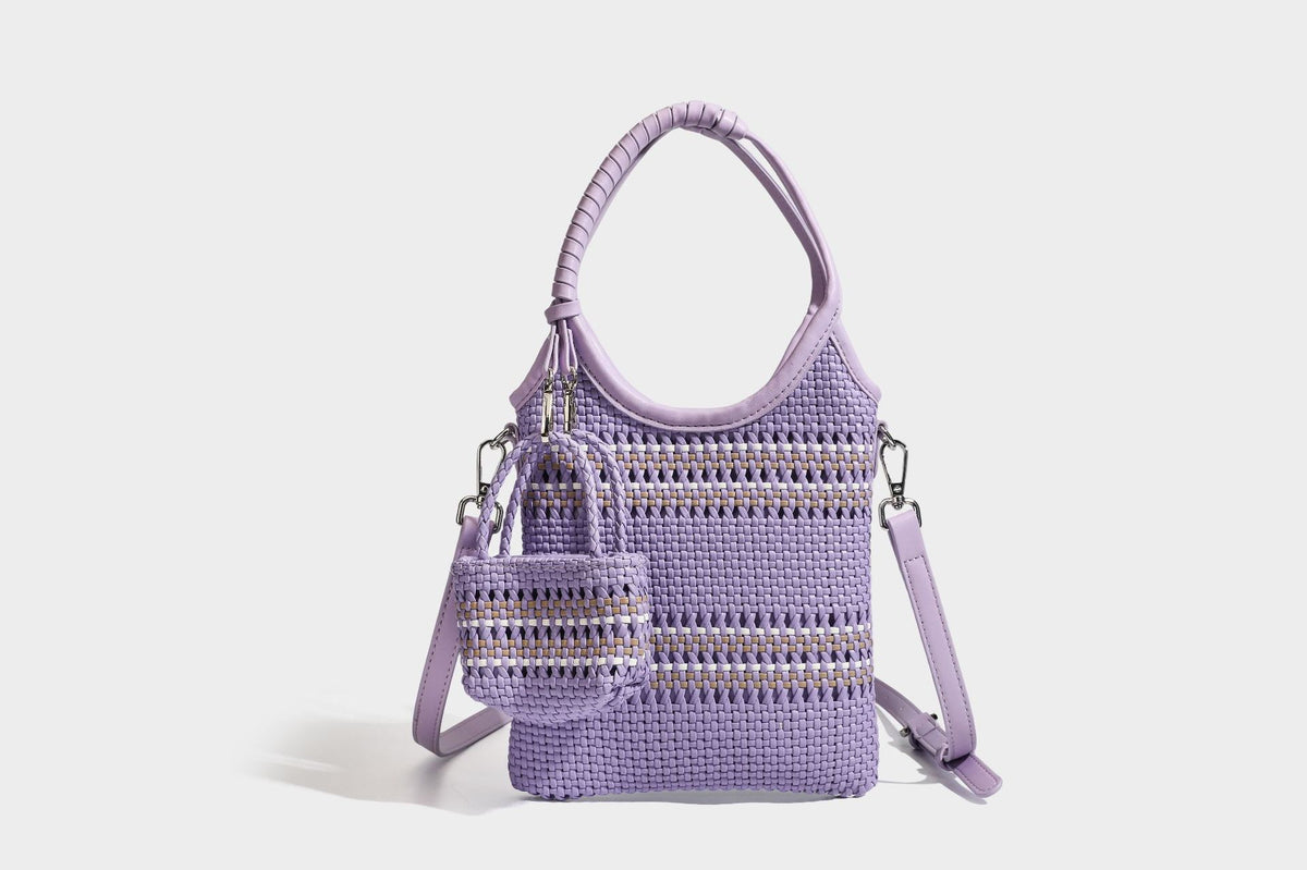 Color-block woven tote bag with rounded leather-look handles, detachable crossbody strap, and matching mini clip-on pouch in