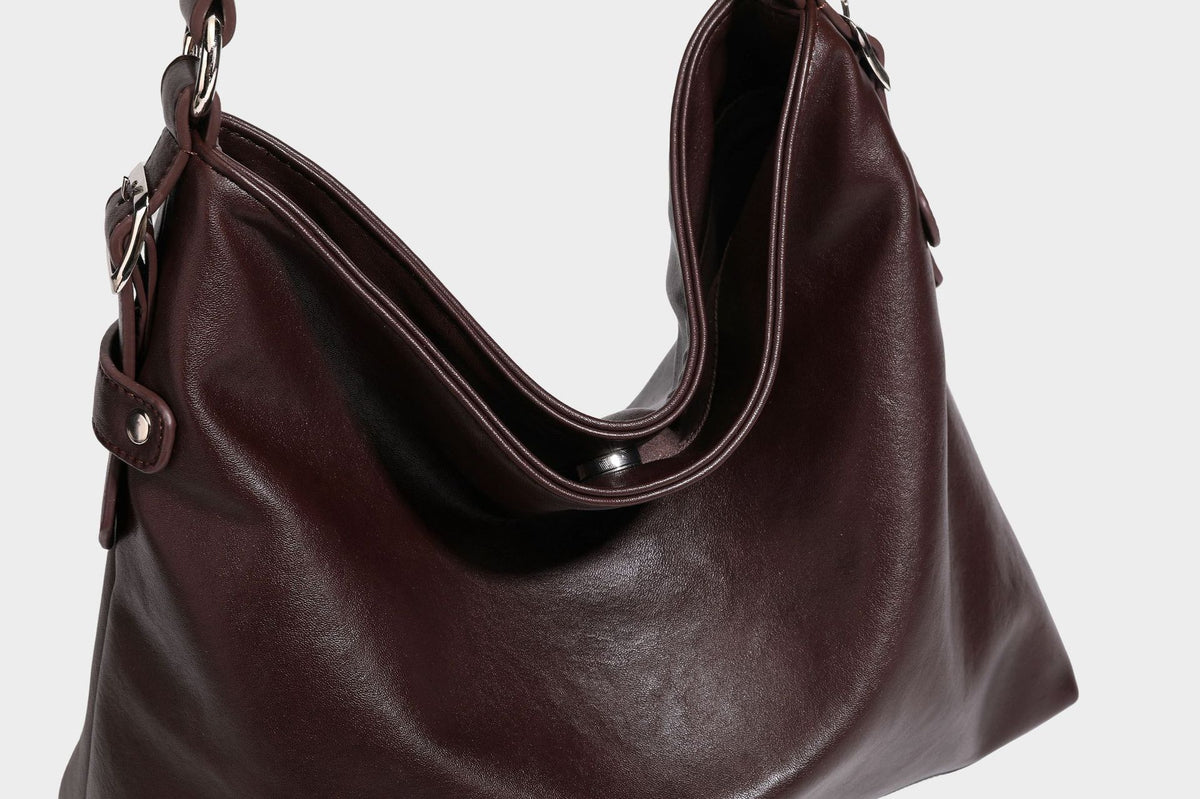 Large slouchy hobo shoulder bag in dark brown with smooth leather-look finish, adjustable strap, and silver-tone hardware