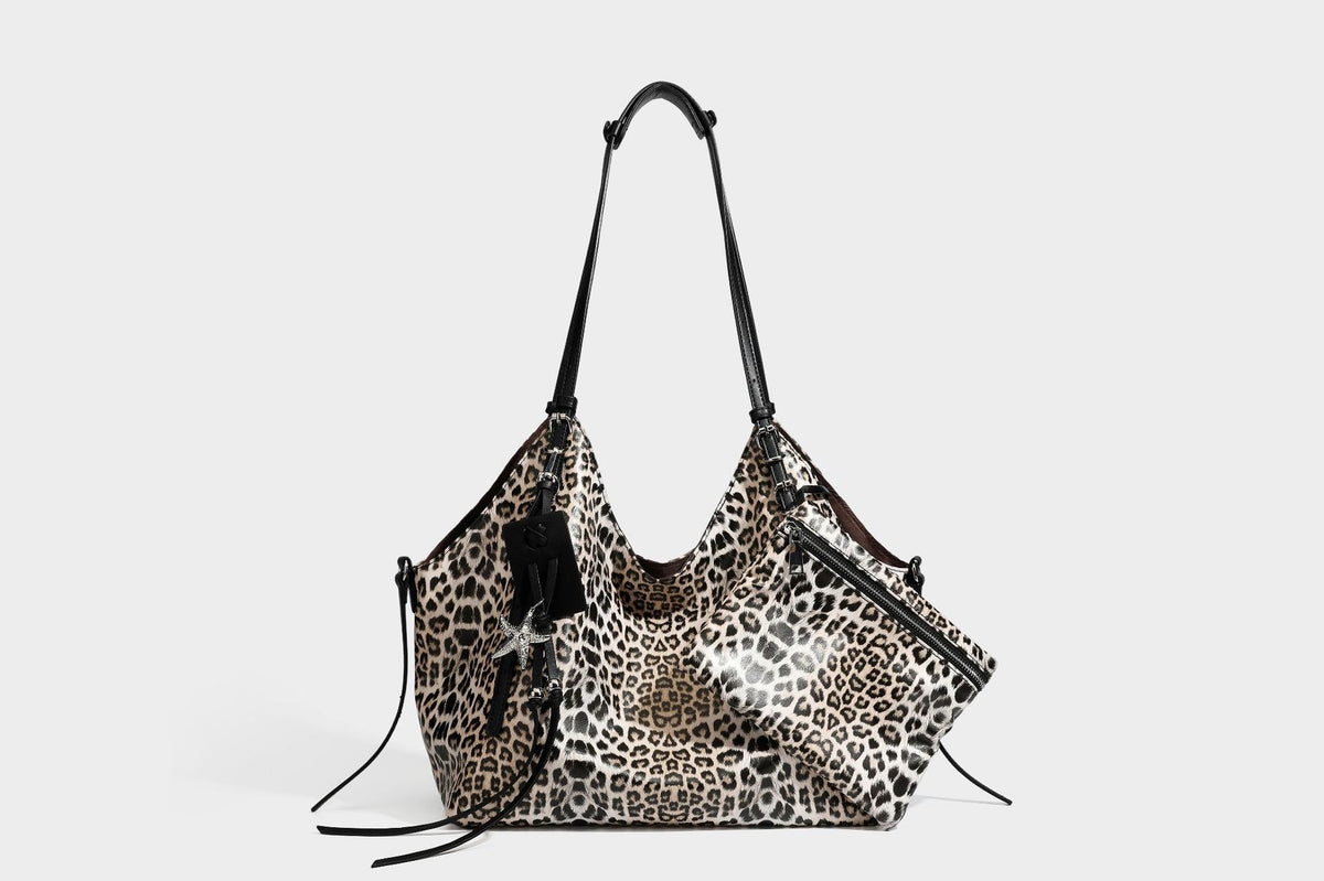 Large leopard print shoulder tote bag with glossy finish, long double straps, front zip pocket, silver-tone hardware, and