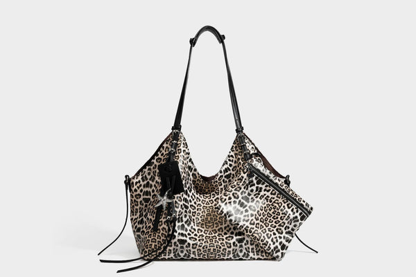 Large leopard print shoulder tote bag with glossy finish, long double straps, front zip pocket, silver-tone hardware, and