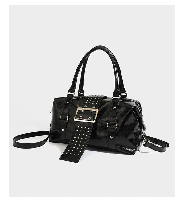 Glossy crinkled barrel handbag with silver stud buckle strap and detachable shoulder strap, detail view 8