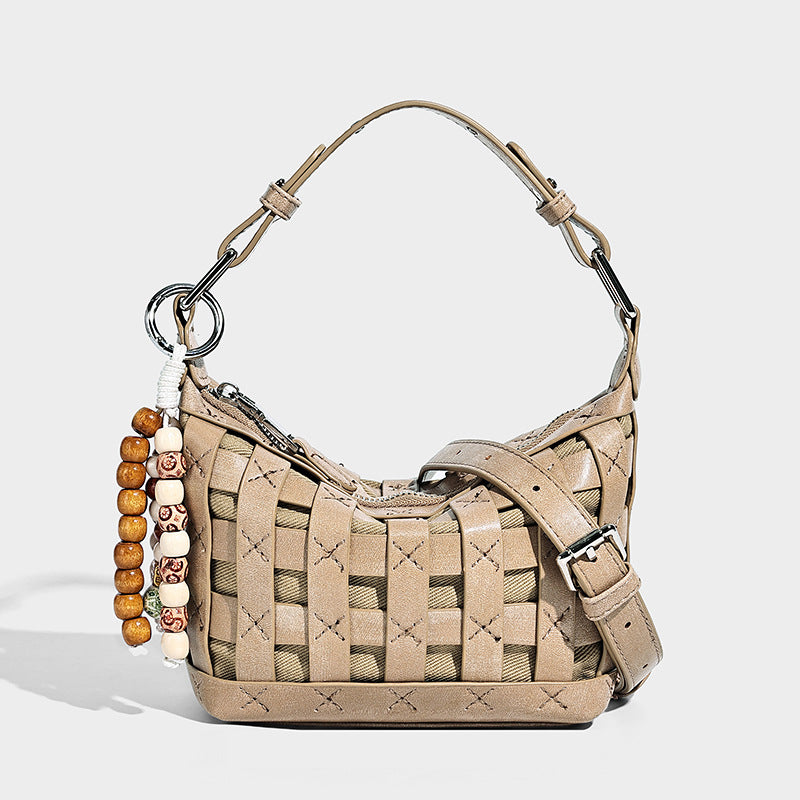 Small woven convertible shoulder bag with top zipper, silver-tone hardware, and detachable crossbody strap, detail view 3