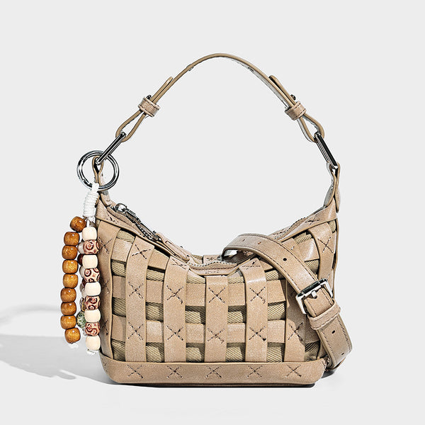 Small woven convertible shoulder bag with top zipper, silver-tone hardware, and detachable crossbody strap, detail view 3