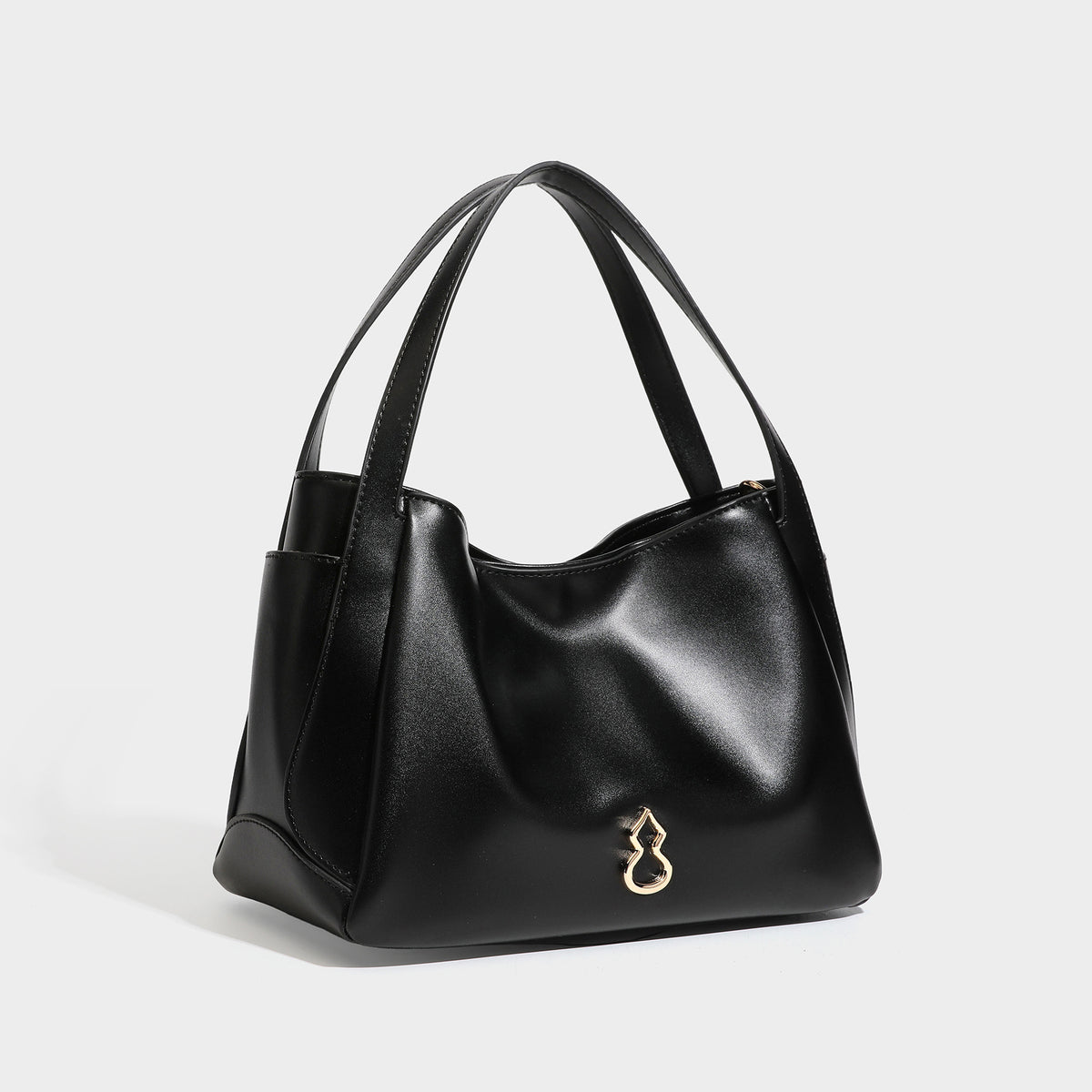 Structured glossy leather-look tote shoulder bag with dual top handles, detachable crossbody strap, side pockets, and, detail