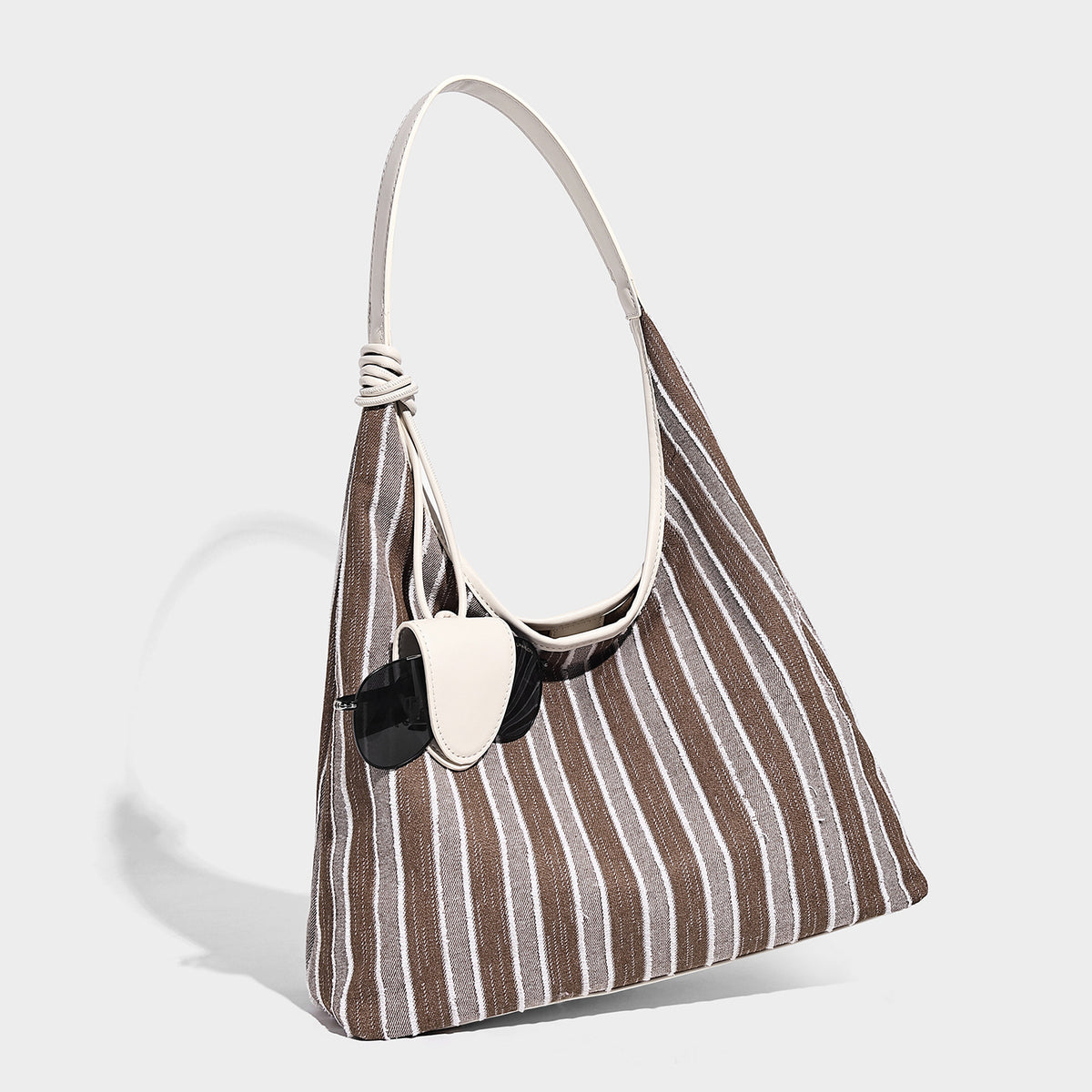 Slouchy striped canvas hobo shoulder bag with cream trim and long knotted strap, detail view 6