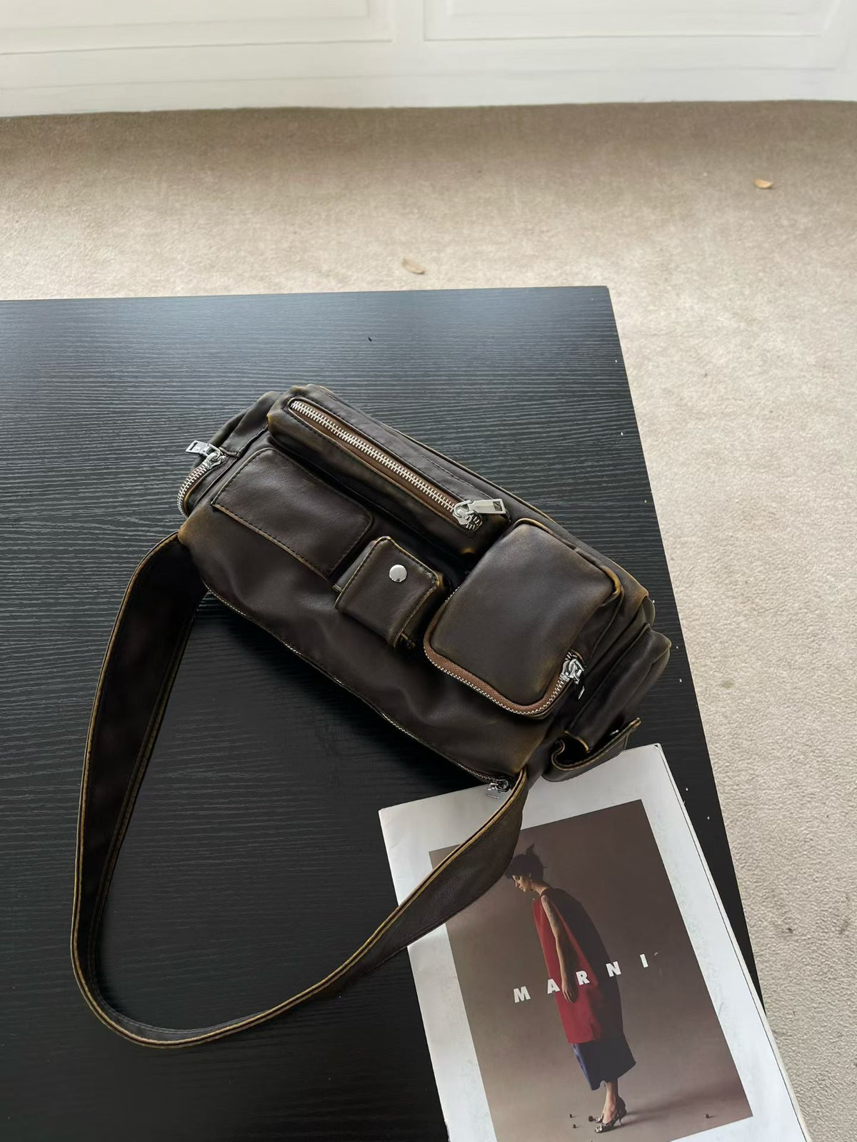 Slouchy multi-pocket leather-look shoulder bag with silver-tone hardware and adjustable strap, detail view 8
