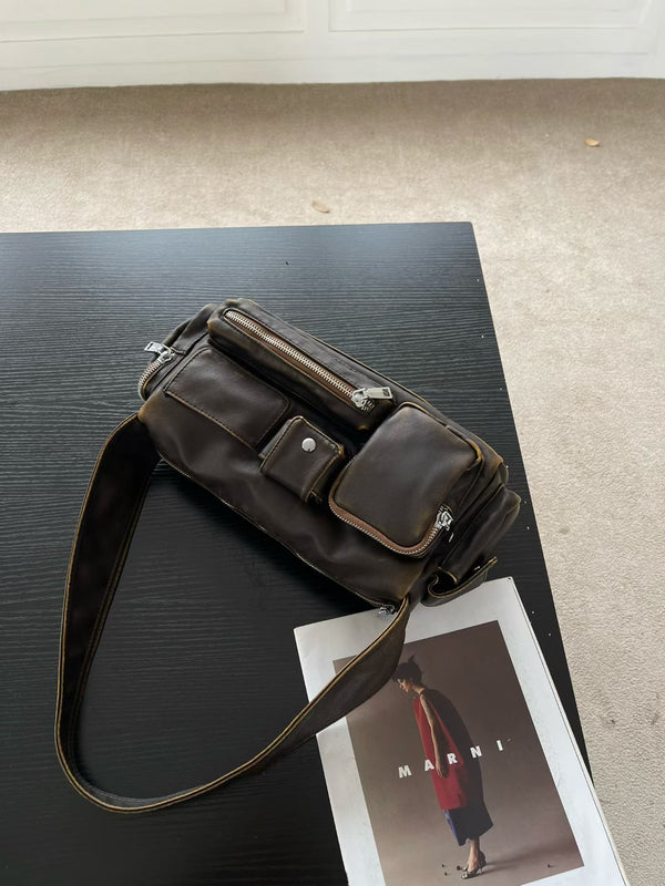 Slouchy multi-pocket leather-look shoulder bag with silver-tone hardware and adjustable strap, detail view 8