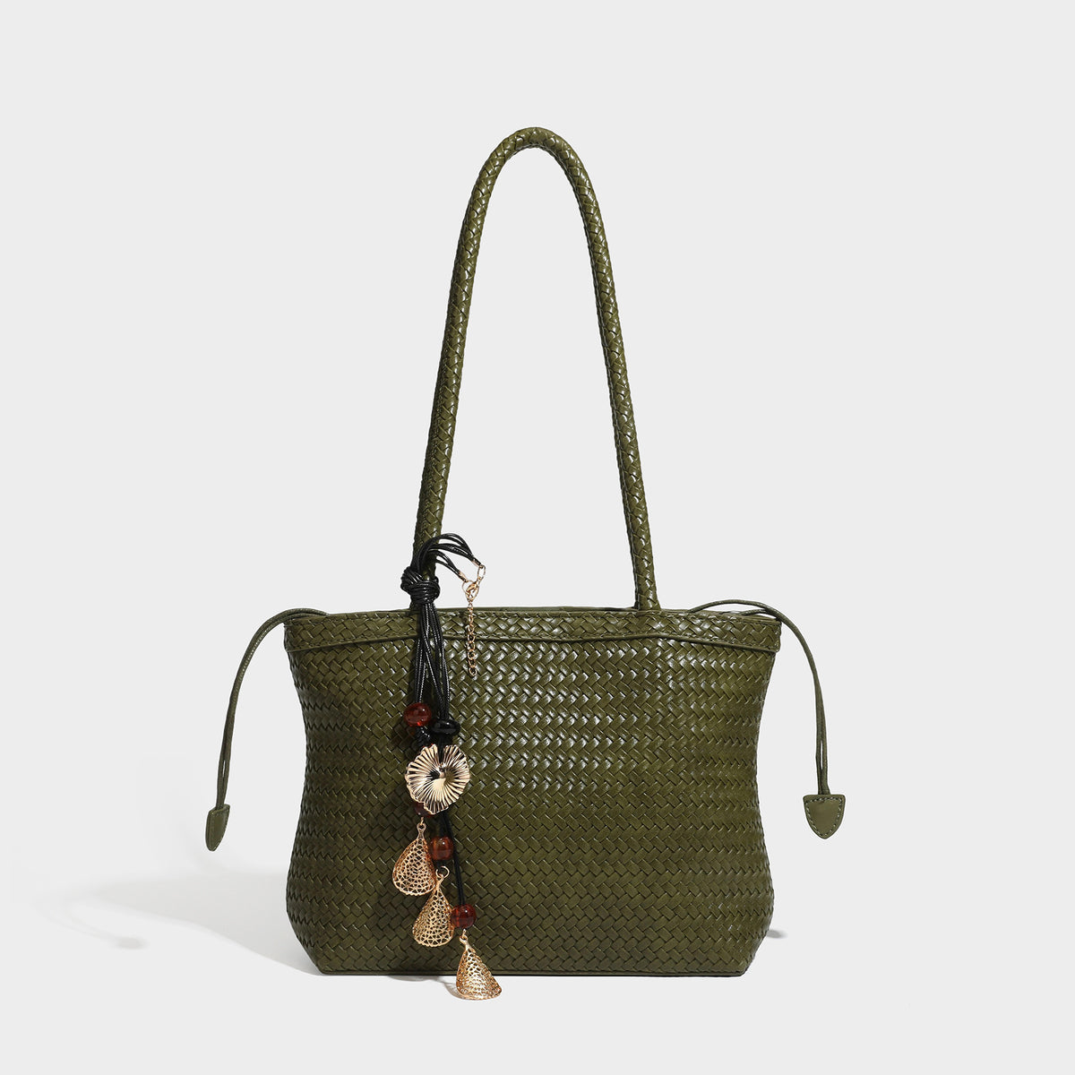 Structured woven leather-look tote bag in dark brown with long shoulder straps, side drawstring ties, and gold filigree