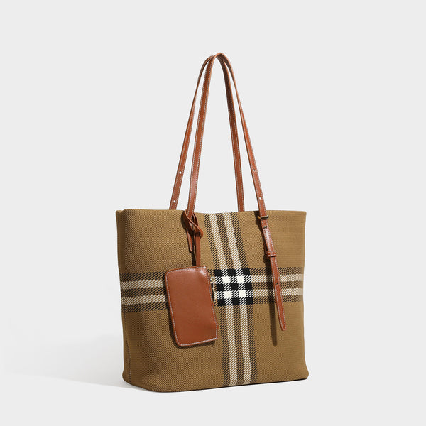 Large structured plaid check tote bag with smooth tan leather-look shoulder straps, attached front zip pouch, and gold-tone