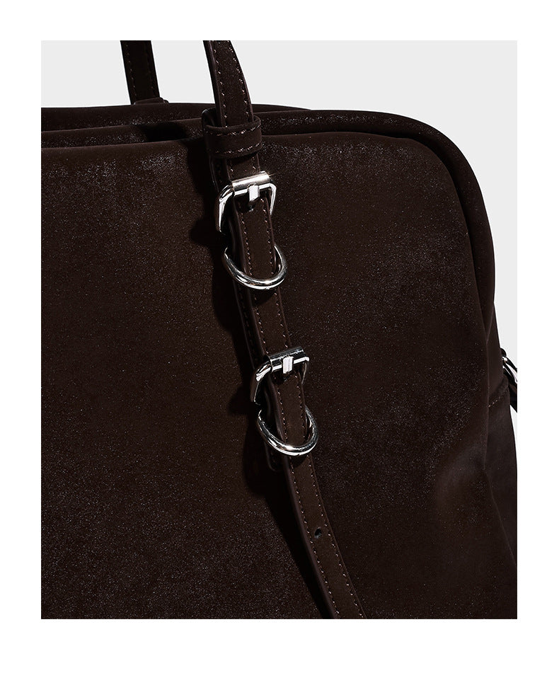 Structured rectangular matte suede-like shoulder bag with silver-tone hardware, zip closure, double top handles, and, detail