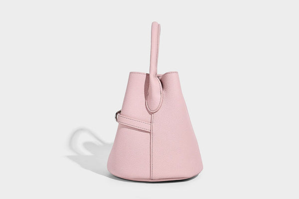 Mini pebbled leather-look bucket bag with front buckle strap, silver-tone hardware, top handle, and detachable shoulder