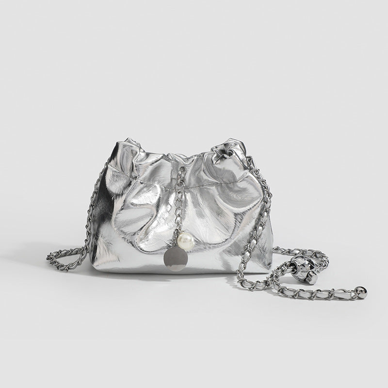 Small ruched drawstring bucket bag with twisted-link chain strap and pearl charm pull, detail view 6