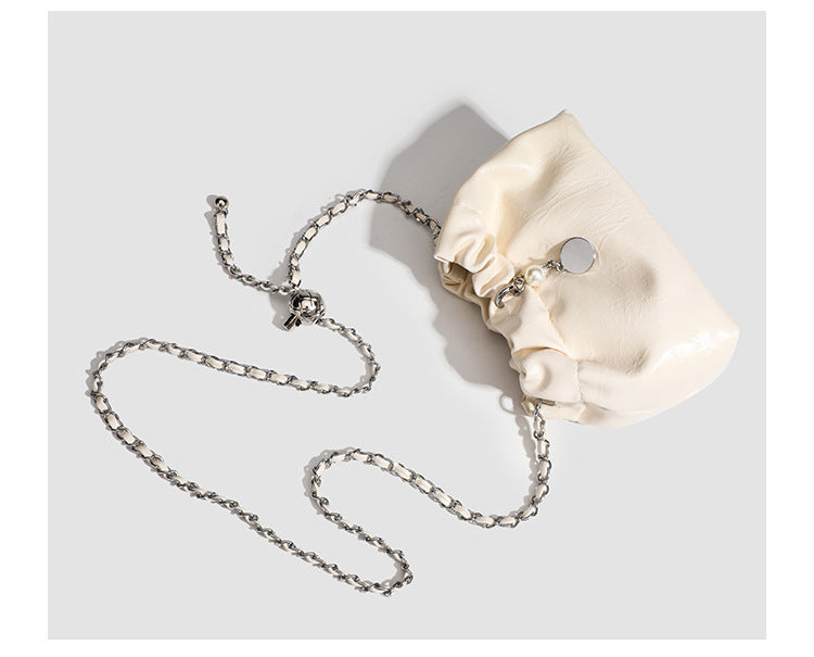 Small ruched drawstring bucket bag with twisted-link chain strap and pearl charm pull, detail view 13
