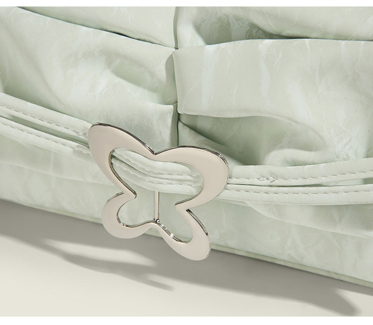 Structured rectangular chain shoulder bag with silver butterfly clasp and glossy crinkled finish, detail view 9