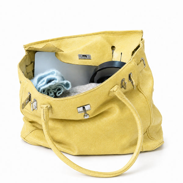 Large structured tote bag with turn-lock closure, silver-tone buckle hardware, and twin rolled handles, detail view 4