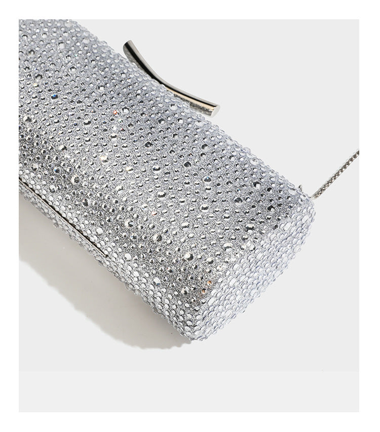 Structured rectangular hard-case clutch bag covered in all-over rhinestone crystal embellishment with curved kiss-lock top