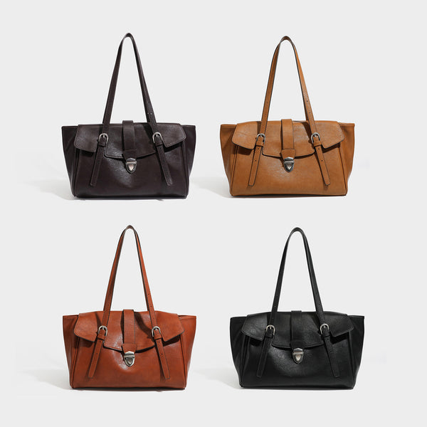 Large structured vintage-style tote bag with flap-front turn-lock closure, twin buckle straps, and double shoulder handles