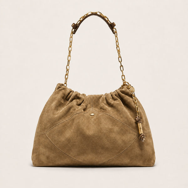 Slouchy suede-look shoulder bag with gathered top, angular stitched paneling, and chunky gold-tone chain strap, front view