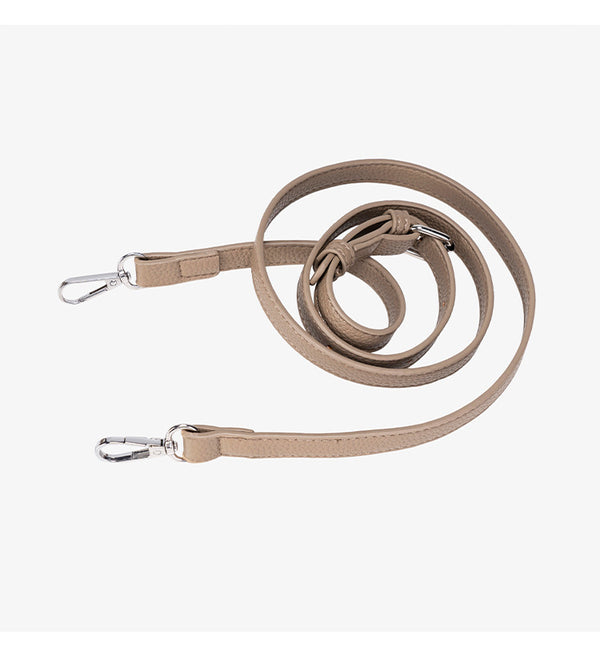 Compact structured bucket bag in pebbled leather-look finish with silver turn-lock front clasp, dual top handles, detachable
