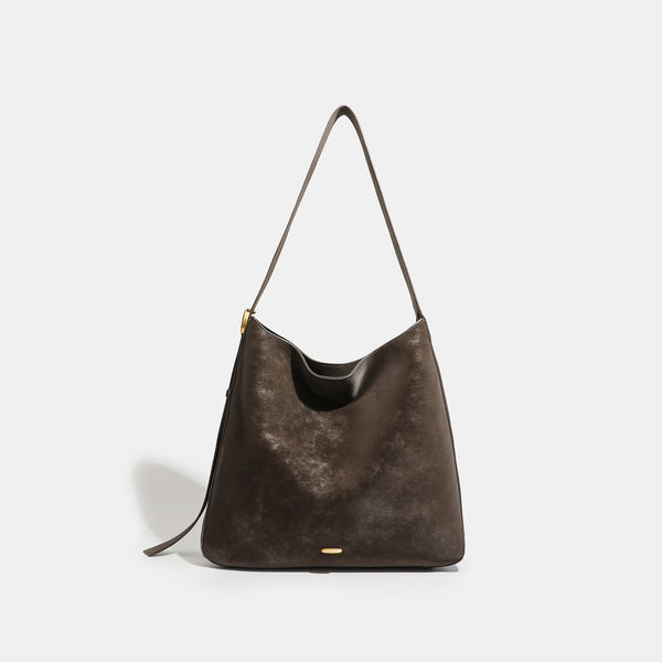 Large slouchy hobo tote bag in distressed dark brown leather-look finish with long shoulder strap, gold-tone ring hardware
