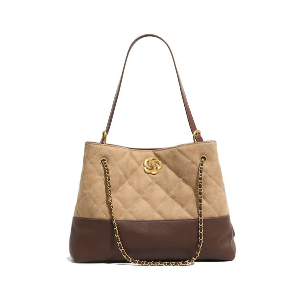 Two-tone tan quilted and dark brown leather-look tote bag with gold chain strap and floral knot emblem, detail view 5