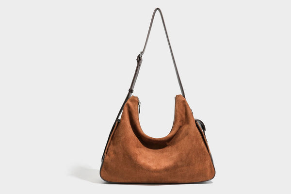 Slouchy cognac brown matte suede-look hobo shoulder bag with dark brown leather-look trim, top zip closure, front flap
