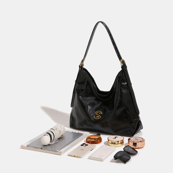 Glossy crinkled hobo shoulder bag with gold-tone logo hardware and adjustable strap, detail view 2